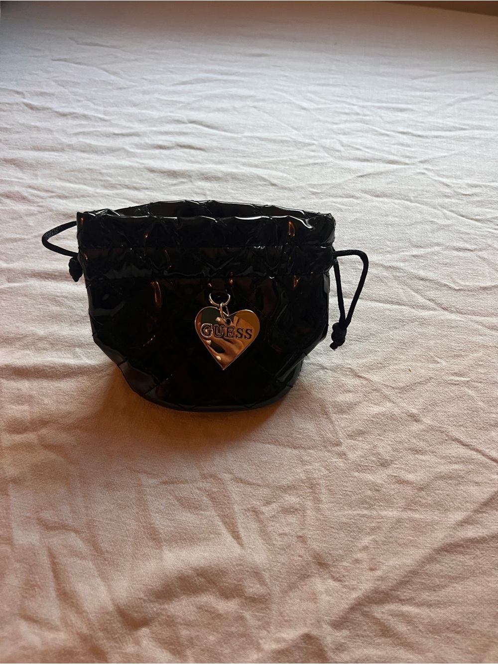 GUESS Patent Black Quilted Drawstring Cosmetic Pouch with Heart Charm